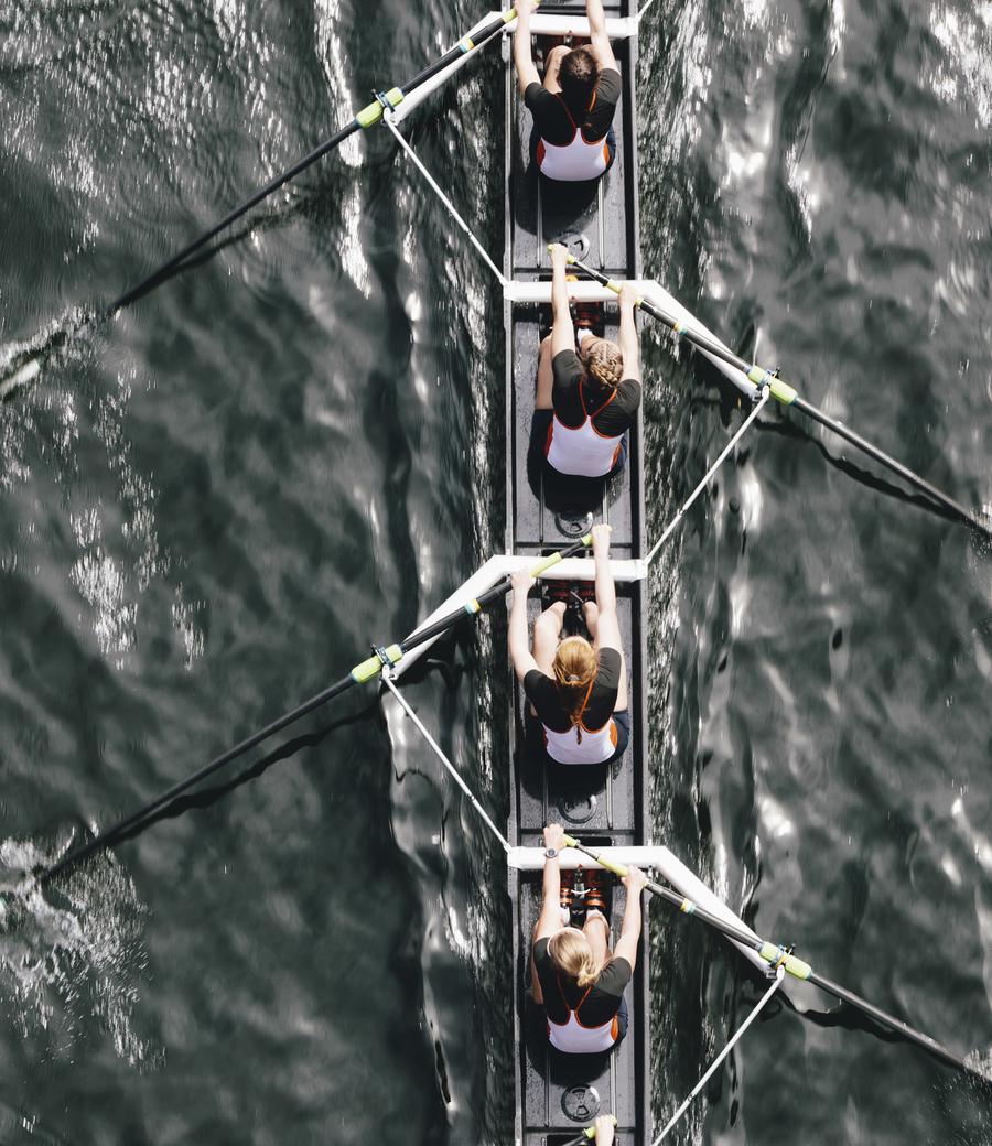 A rowing crew moving in perfect synchronisation
